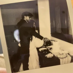 a bride and groom cutting their wedding cake