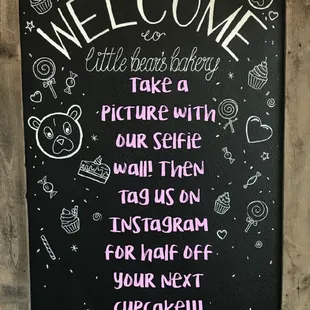 a chalkboard with a sign that says welcome little bears bakery