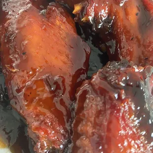 Chicken wings - caramelized with Beijing sauce.  Large pieces and very generous in servings!