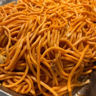 a pile of noodles in a metal pan