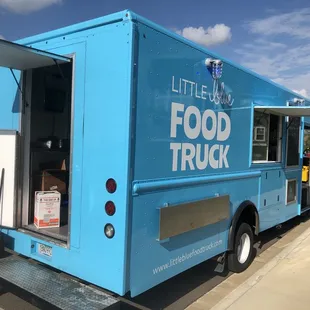 a food truck parked on the side of the road