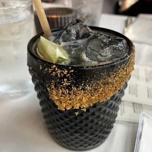 a drink with ice and lime