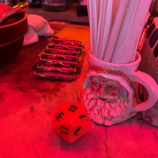 a cup of strawberries and a red light