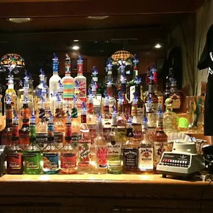 a shelf of liquor bottles
