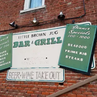a brick building with signs on it