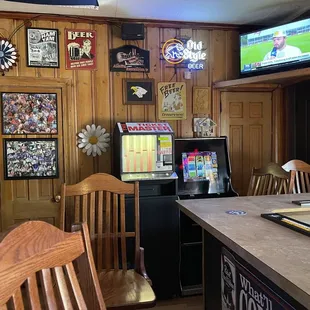 a bar with a television and a bar top