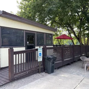 a patio with a table and chairs