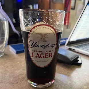 a glass of beer on a table