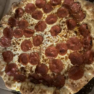 a pepperoni pizza in a box
