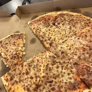 a half eaten pizza in a box