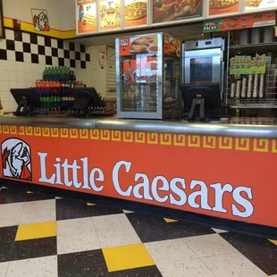 a little caesars sign on the counter