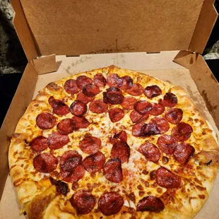 a pepperoni pizza in a box