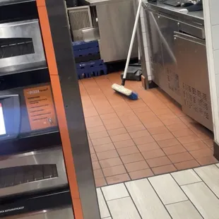 a person cleaning a kitchen