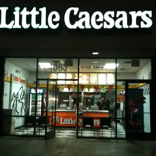 the entrance of a little caesars restaurant