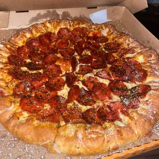 a pepperoni pizza in a box