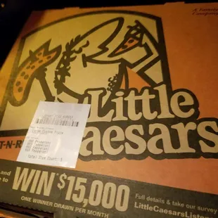 a pizza box with a price tag on it
