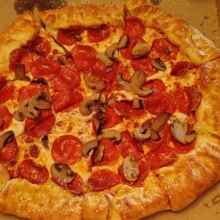 Stuffed crust pizza with pepperoni and mushroom.