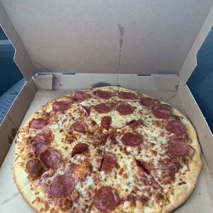a pepperoni pizza in a box