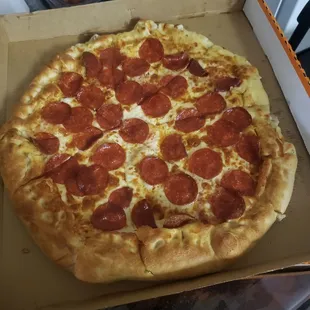 a pepperoni pizza in a box