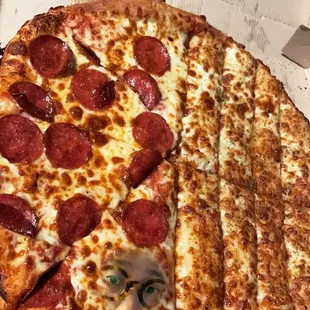 a pepperoni pizza in a box
