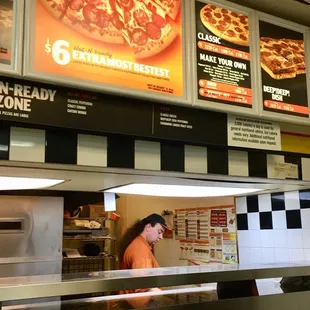a woman behind the counter