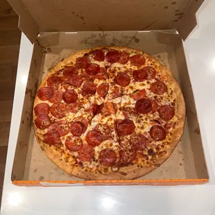 a pepperoni pizza in a box