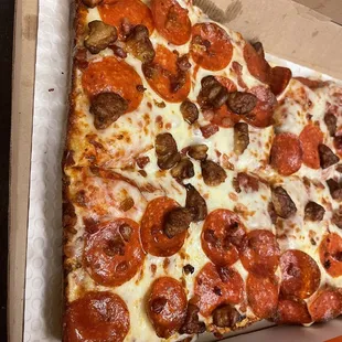 a slice of pizza in a box