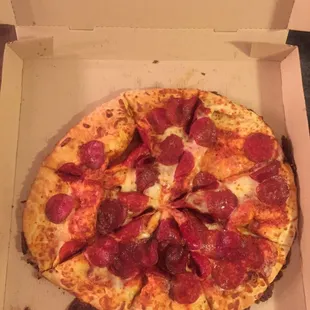 a pepperoni pizza in a box