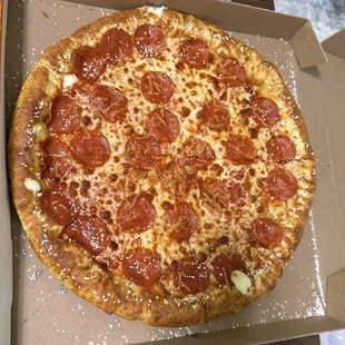 a pepperoni pizza in a box