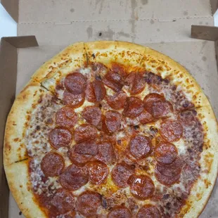 a pepperoni pizza in a box