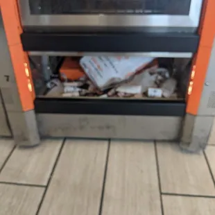 Every other compartment was empty, the three at the bottom were all filled with trash and someone still placed my food there. What a joke.