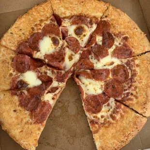 a pepperoni pizza in a box