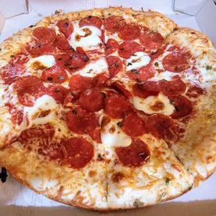 &quot;Mozziago&quot;, (pardon arm shadows), greasy, over-the-top, oozing with cheese, flavorful pepperoni in every bite. Unique &amp; tasty!