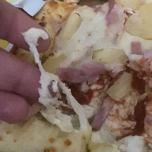 I couldn't add the video but here are stills ... that's NOT cheese! Some of the cheese wasn't even melted. RAW