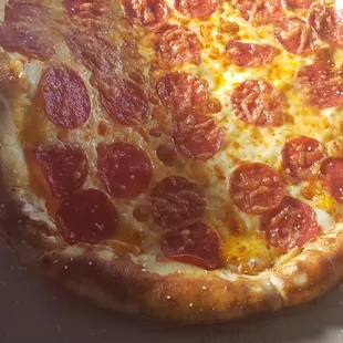 a pepperoni pizza in a box