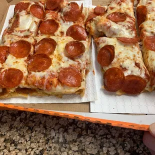 two slices of pepperoni pizza
