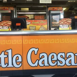 a little caesars sign in the window