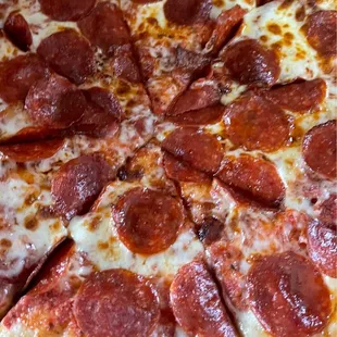 a pepperoni pizza cut into eight slices