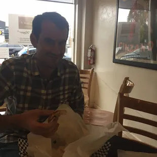 a man eating a sandwich