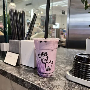 a cup of bubble tea on a counter