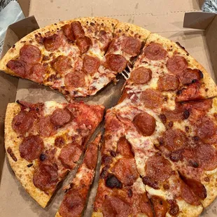a pepperoni pizza in a box