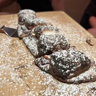 a long pastry on a wooden table
