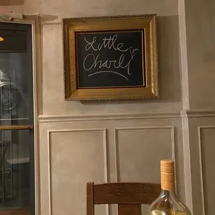 a chalkboard on the wall of a restaurant