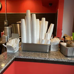 a counter full of cups