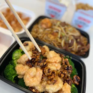 a plate of food with chopsticks