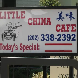 the sidewalk signboard (looking north)