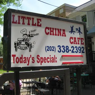 the sidewalk signboard (looking south)