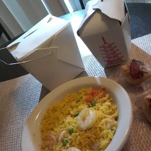 a plate of rice and shrimp