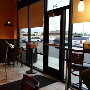 Menu stand right in front of the door.  Not much space.