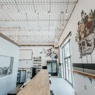 a long wooden table in the middle of the room